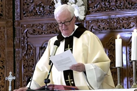 Fr. Míċeál O'Neill reading the Popes letter